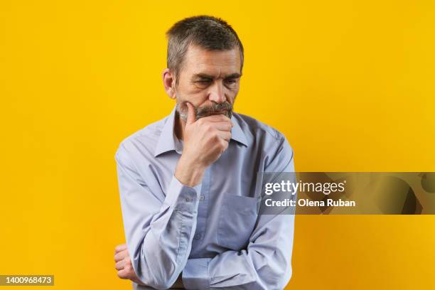 thoughtful gray-bearded mature man. - old wise business man white stock pictures, royalty-free photos & images