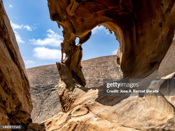 cave with natural arches produced by erosion on top of a mountain. - stalagmite stock pictures, royalty-free photos & images