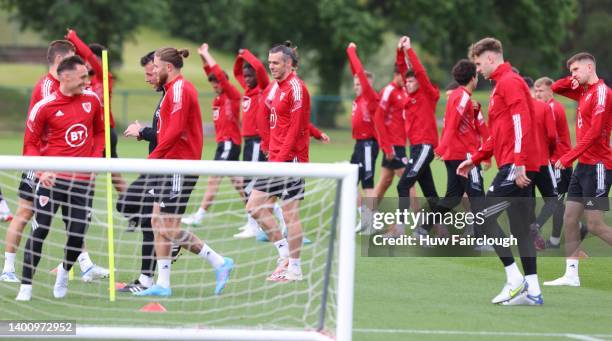 The Wales Football squad stretches during the Wales FA training session ahead of their World Cup eliminator against Ukraine at The Vale Resort on...