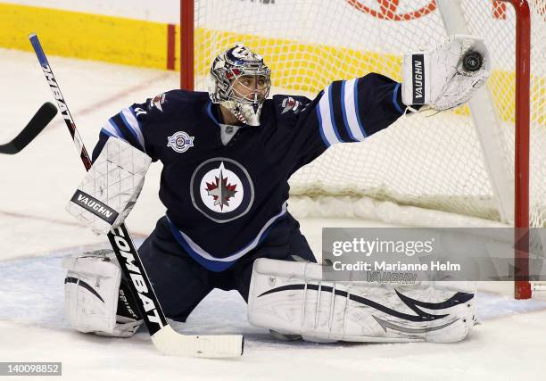Ondrej Pavelec of the Winnipeg Jets makes a save in a game against the Edmonton Oilers in NHL action at the MTS Centre on February 27, 2012 in...