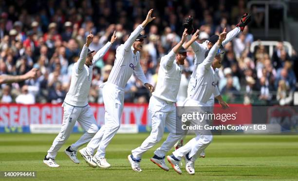 England slips Joe Root, Zak Crawley, Jonathan Bairstow and Ollie Pope celebrate the wicket of Kyle Jamieson of New Zealand during day three of First...