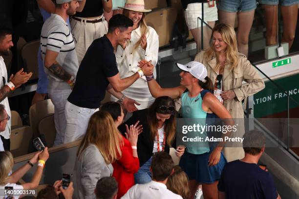 Iga Swiatek of Poland celebrates with Robert Lewandowski after winning against Coco Gauff of The United States during the Women’s Singles final match...