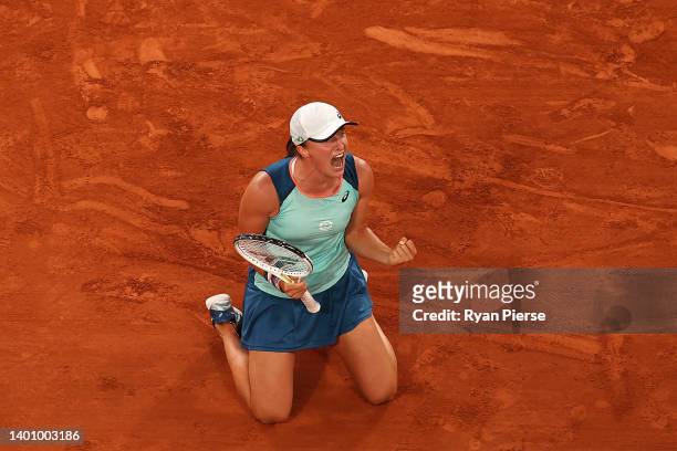 Iga Swiatek of Poland celebrates after winning match point against Coco Gauff of The United States during the Women’s Singles final match on Day 14...