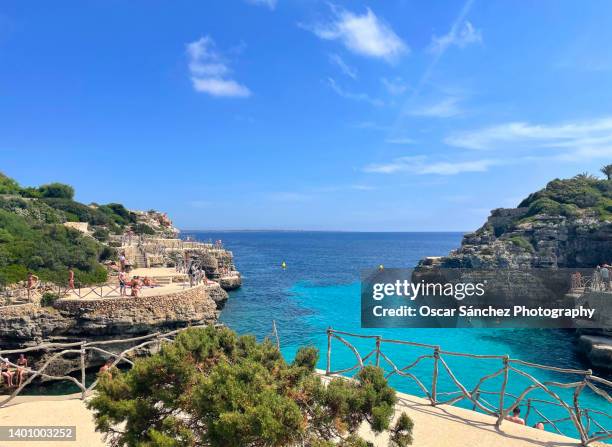 cala en brut, paradise beach in menorca, balearic islands - inlet stockfoto's en -beelden