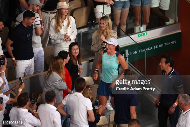 Iga Swiatek of Poland reacts to seeing Robert Lewandowski in the crowd after winning against Coco Gauff of The United States during the Women’s...