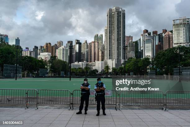 Police officers stand guards at Victoria Park, the traditional site of the annual Tiananmen candlelight vigil, on June 04, 2022 in Hong Kong, China....