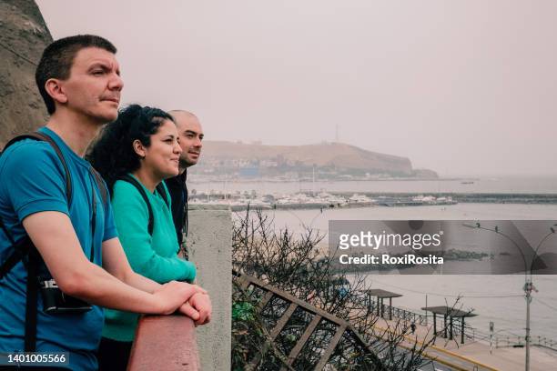 three people in a viewpoint of lima peru - lima ストックフォトと画像