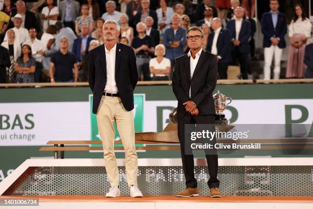 Gilles Moretton French Tennis Federation President and Mats Wilander look on from the presentation ceremony after Iga Swiatek of Poland wins against...