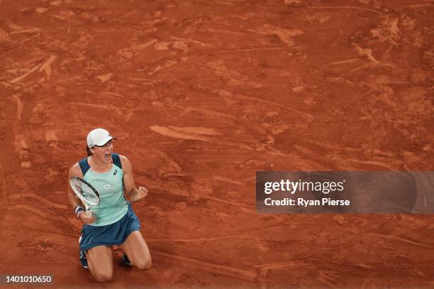 Iga Swiatek of Poland celebrates after winning match point against Coco Gauff of The United States during the Women’s Singles final match on Day 14...