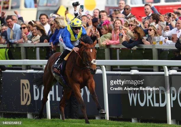 Richard Kingscote riding Desert Crown to victory in the Cazoo Derby during Cazoo Derby meeting at Epsom Racecourse on June 04, 2022 in Epsom, England.