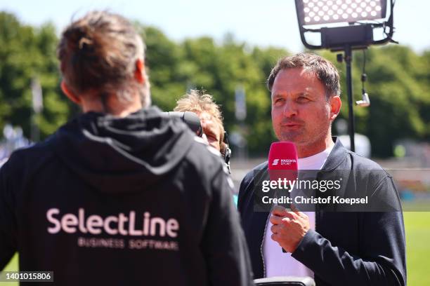 Thomas Wagner, field reporter of Magenta Sport speaks to heqad coach Dario Fossi of VfB Oldenburg prior to the 3. Liga Play-Off second leg match...