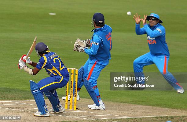 Mahela Jayawardene of Sri Lanka is caught out by Virender Sehwag of India at slip during the One Day International match between India and Sri Lanka...