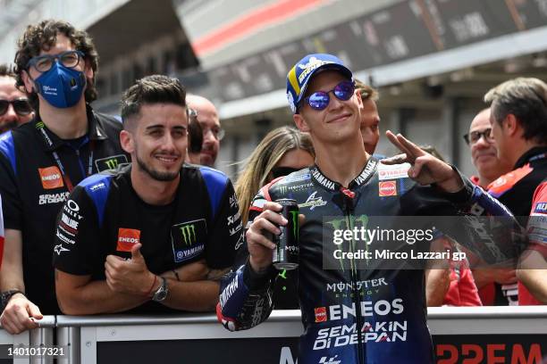 Fabio Quartararo of France and Monster Energy Yamaha MotoGP Team celebrates the third place with team during the MotoGP qualifying practice during...