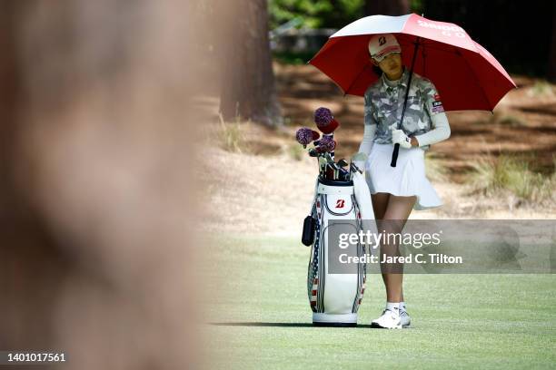 Saki Baba of Japan prepares to play a shot from the 17th fairway during the third round of the 77th U.S. Women's Open at Pine Needles Lodge and Golf...