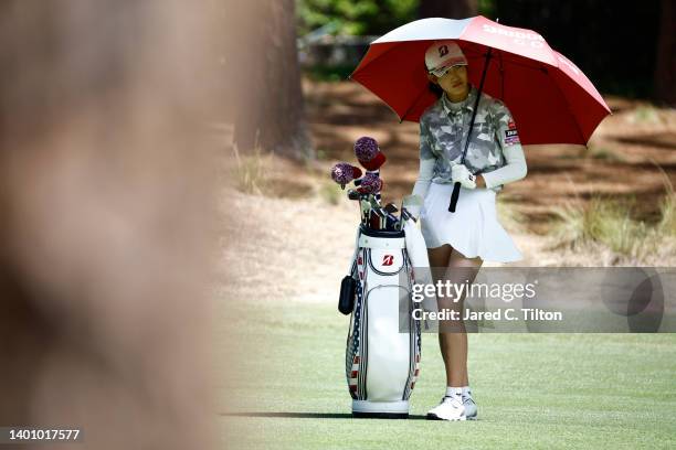 Saki Baba of Japan prepares to play a shot from the 17th fairway during the third round of the 77th U.S. Women's Open at Pine Needles Lodge and Golf...