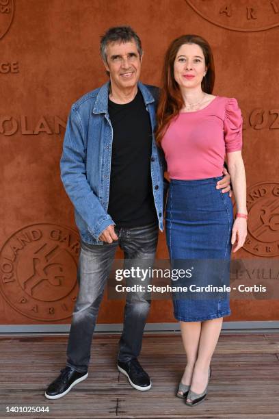 Julien Clerc and Hélène Grémillon attend the French Open 2022 at Roland Garros on June 04, 2022 in Paris, France.