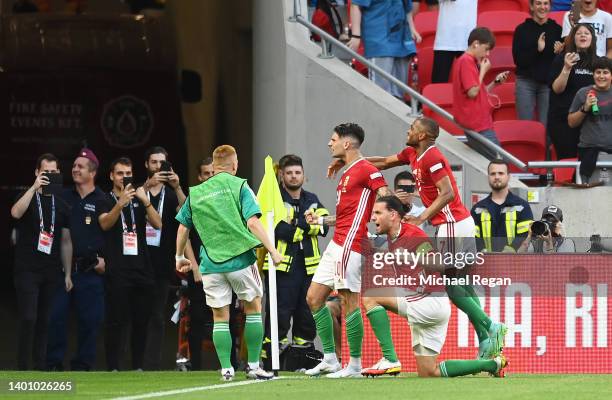 Dominik Szoboszlai of Hungary celebrates with teammates after scoring their team's first goal from the penalty spot during the UEFA Nations League...