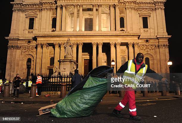 Tent is cleared away from the Occupy protest camp outside Saint Paul's Cathedral in central London early on February 28 as police and bailiffs evict...