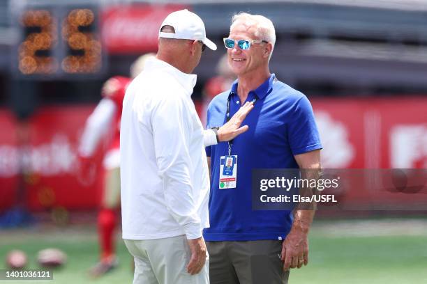 Daryl Johnston, Executive Vice President of USFL Football Operations, talks with head coach Skip Holtz of the Birmingham Stallions before the game...