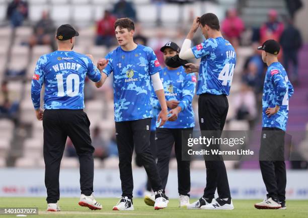 Henry Crocombe of Sussex Sharks is congratulated by Luke Wright of Sussex Sharks after bowling James Vince of Hampshire Hawks during the Vitality T20...