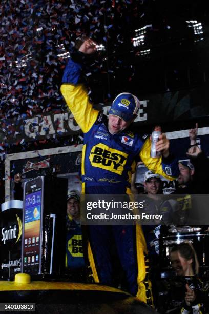 Matt Kenseth, driver of the Best Buy Ford, celebrates in Victory Lane after winning the NASCAR Sprint Cup Series Daytona 500 at Daytona International...