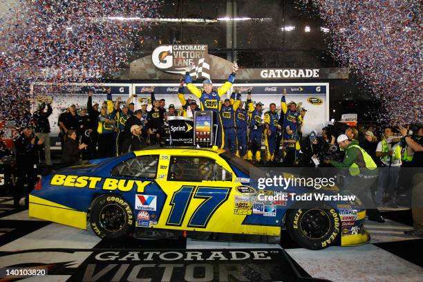 Matt Kenseth, driver of the Best Buy Ford, celebrates in Victory Lane after winning the NASCAR Sprint Cup Series Daytona 500 at Daytona International...