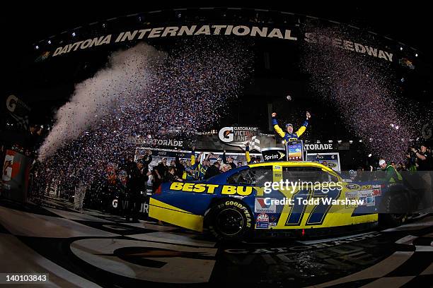 Matt Kenseth, driver of the Best Buy Ford, celebrates in Victory Lane after winning the NASCAR Sprint Cup Series Daytona 500 at Daytona International...