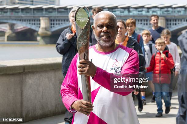 Batonbearer Henry Palton-Gaspard carries the Queen’s Baton on Thames Path during a relay from Blackfriars Pier to Paternoster Square, during the...