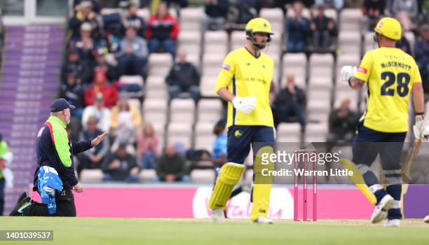 Umpire Ian Blackwell signals a boundary on his knees as he avoided being hit by Ben McDermott of Hampshire Hawks during the Vitality T20 Blast...