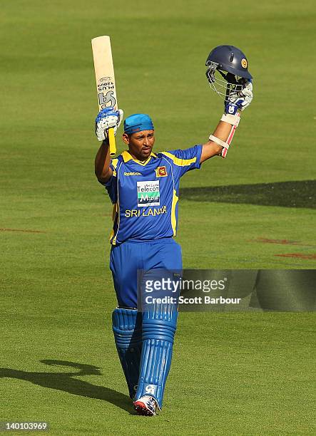 Tillakaratne Dilshan of Sri Lanka celebrates after reaching his century during the One Day International match between India and Sri Lanka at...