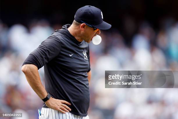 Manager Aaron Boone of the New York Yankees blows a bubblegum bubble during the ninth inning against the Detroit Tigers at Yankee Stadium on June 04,...