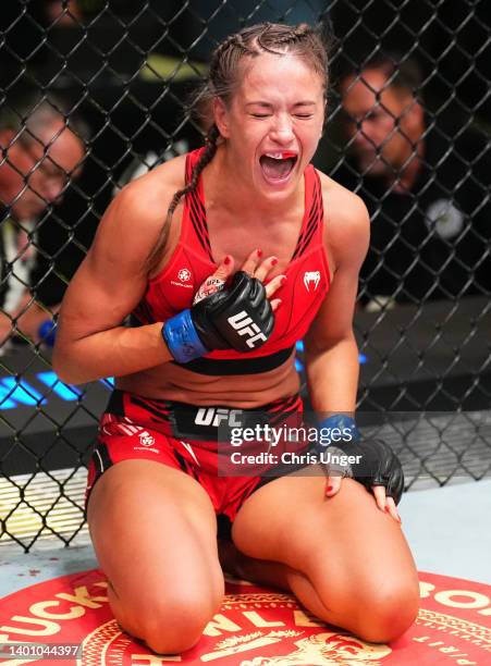 Karolina Kowalkiewicz of Poland reacts after her submission victory over Felice Herrig in a strawweight fight during the UFC Fight Night event at UFC...
