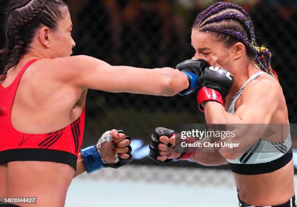 Karolina Kowalkiewicz of Poland punches Felice Herrig in a strawweight fight during the UFC Fight Night event at UFC APEX on June 04, 2022 in Las...