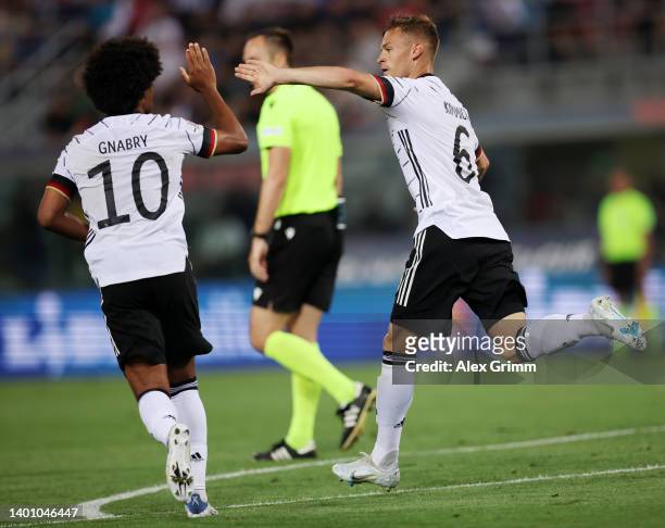 Joshua Kimmich of Germany celebrates with teammate Serge Gnabry after scoring their team's first goal during the UEFA Nations League League A Group 3...