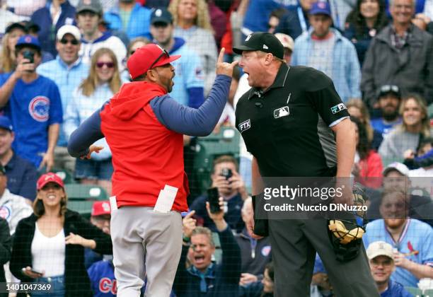 Manager Oliver Marmol of the St. Louis Cardinals has words with home plate umpire Bruce Dreckman during the seventh inning of Game One of a...