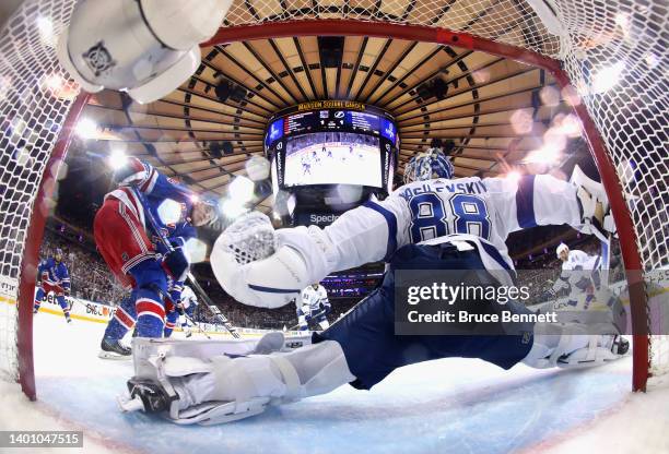 Alexis Lafreniere of the New York Rangers scores against Andrei Vasilevskiy of the Tampa Bay Lightning in Game Two of the Eastern Conference Final of...