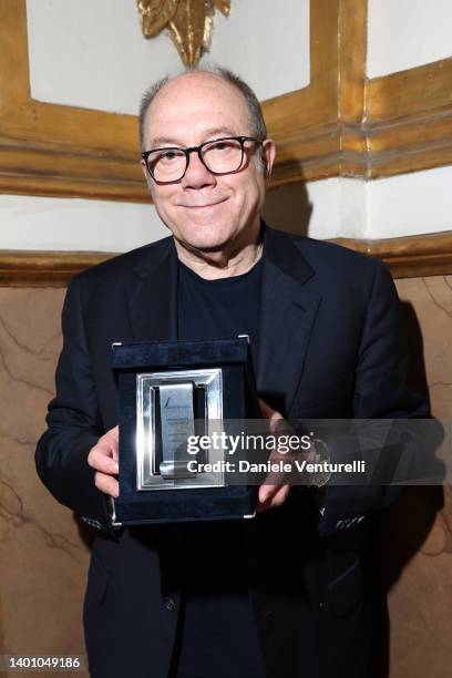 Carlo Verdone poses with the Best Original Series Award for "Vita da Carlo" during the Nastri D'Argento "Grandi Serie" 2022 awards ceremony on June...