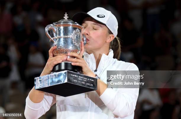 Iga Swiatek of Poland celebrates her victory during the trophy ceremony following the women's final against Coco Gauff of USA on day 14 of the French...