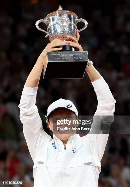 Iga Swiatek of Poland celebrates her victory during the trophy ceremony following the women's final against Coco Gauff of USA on day 14 of the French...