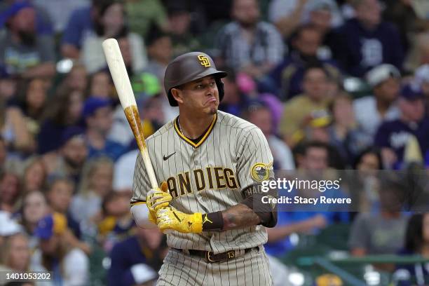 Manny Machado of the San Diego Padres reacts to a pitch by Aaron Ashby of the Milwaukee Brewers during the fifth inning at American Family Field on...