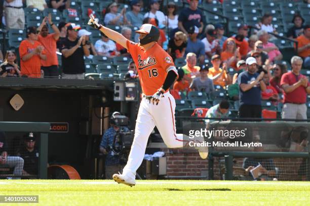Trey Mancini of the Baltimore Orioles celebrates hitting a solo home run in the first inning during a baseball game against the Cleveland Guardians...