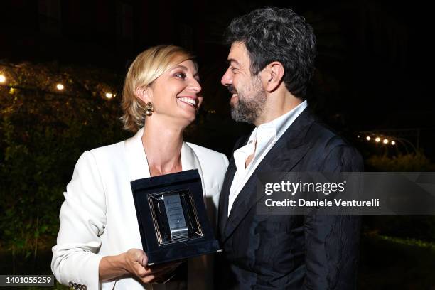 Anna Ferzetti and Pierfrancesco Favino pose with the Best Supporting Actress Award after the Nastri D'Argento "Grandi Serie" 2022 awards ceremony on...