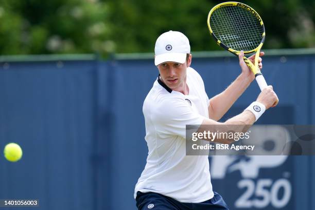 Botic van de Zandschulp of the Netherlands plays a backhand during a Practice Session of the Libema Open Grass Court Championships at the Autotron on...