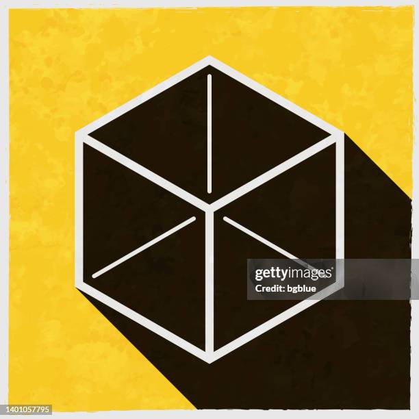 isometric cube. icon with long shadow on textured yellow background - black cube stock illustrations