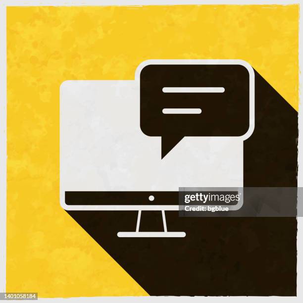 desktop computer with speech bubble. icon with long shadow on textured yellow background - desktop screen background stock illustrations