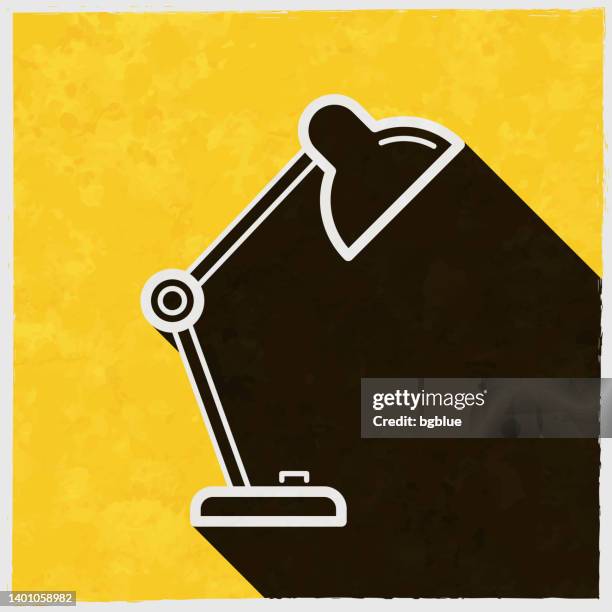 desk lamp. icon with long shadow on textured yellow background - light switch off stock illustrations