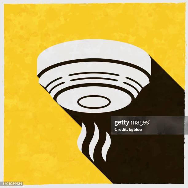 ilustraciones, imágenes clip art, dibujos animados e iconos de stock de detector de humo. icono con sombra larga sobre fondo amarillo texturizado - smoke-detector-with-smoke