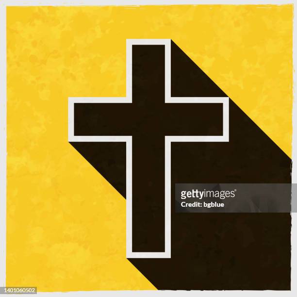 religion cross. icon with long shadow on textured yellow background - celtic cross stock illustrations