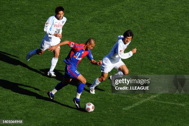 Sota Hirayama of FC Tokyo controls the ball under pressure of Hiroki Ito and Kazuhiro Murakami of Kawasaki Frontale during the J.League Yamazaki...