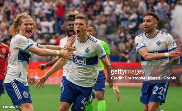 Ranko Veselinovic of the Vancouver Whitecaps celebrates his goal with Florian Jungwirth of the Vancouver Whitecaps and Erik Godoy of the Vancouver...